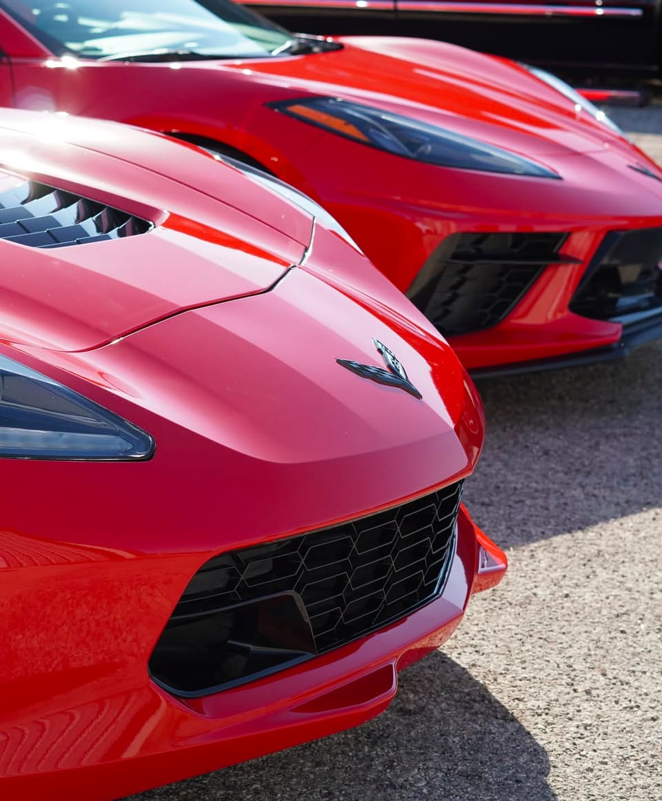 The front end of a red Chevrolet Corvette after detailing
